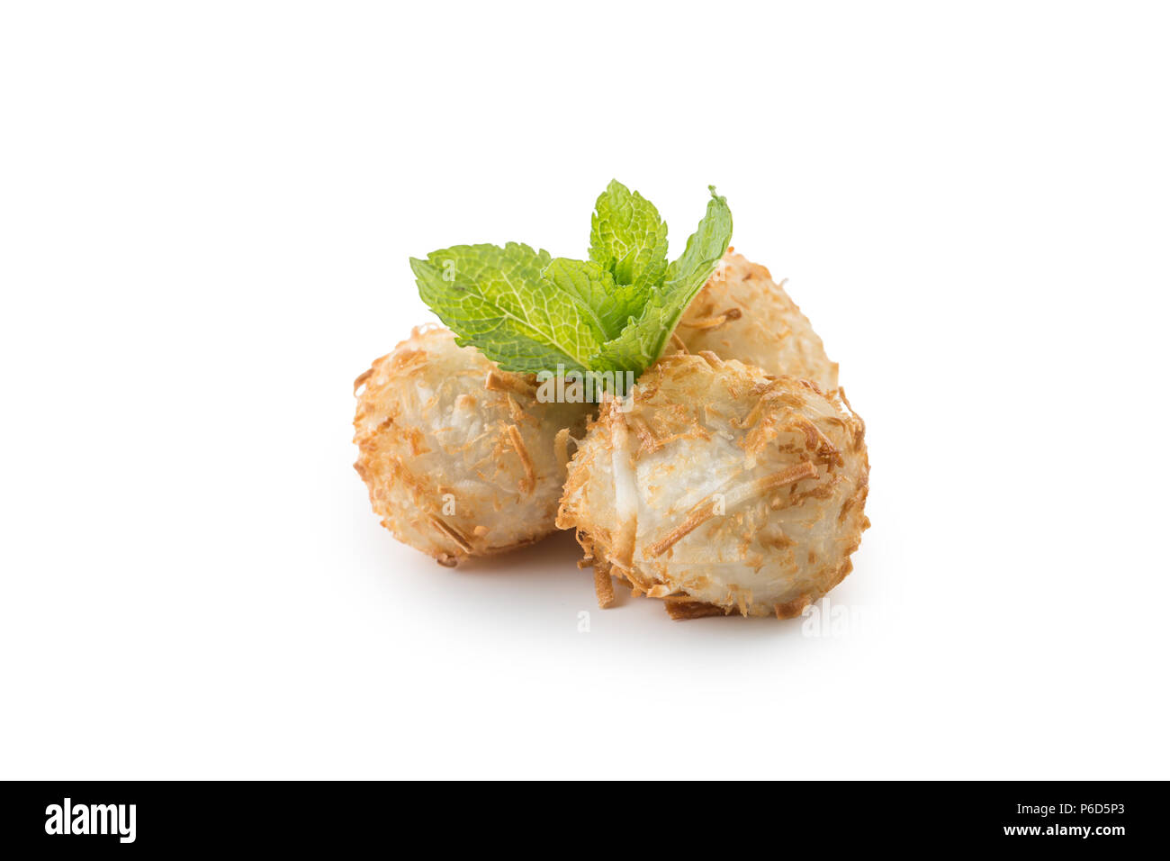 Traditional japanese fried sweet coconut balls with mint leaves