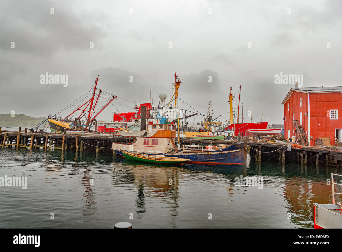 Fishing boats in Yarmouth harbour on a rainy day. Yarmouth, Nova Scotia