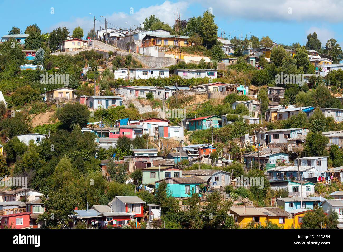 Poor houses on the hills of a small town named Tome, Bio Bio Region, Chile Stock Photo