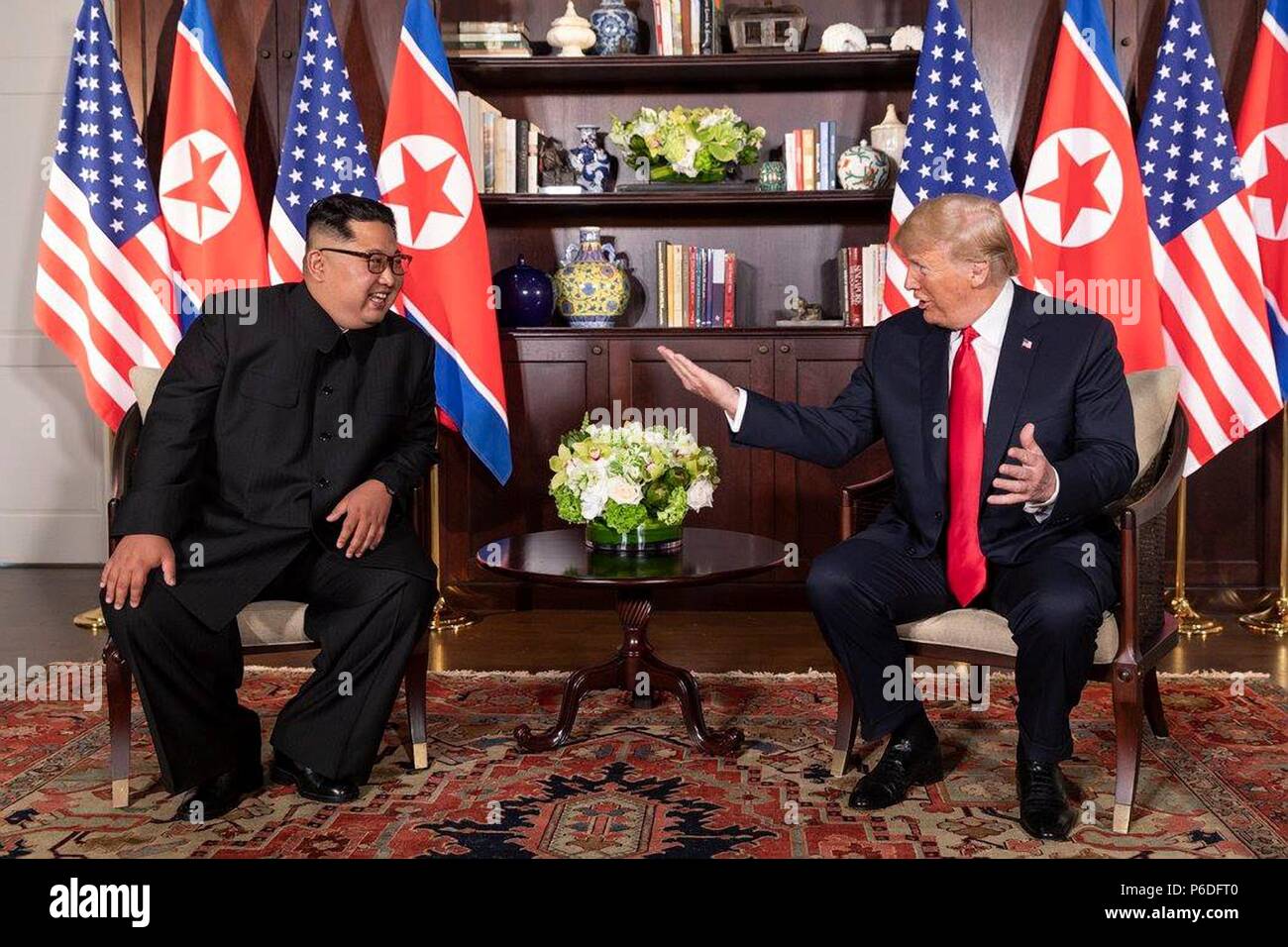 U.S. President Donald Trump, right, chats with North Korean Leader Kim ...