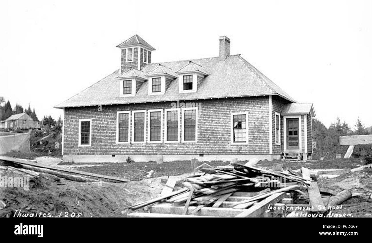 . English: Government school, Seldovia, ca. 1912 . English: Caption on image: Government school, Seldovia, Alaska PH Coll 247.315 Seldovia is on the Kenai Peninsula across from Homer on the south shore of Kachemak Bay. Native residents are mixed Dena'ina Indian and Sugpiaq Eskimo (also known as Alutiiq). The name Seldovia is derived from 'Seldevoy' a Russian word meaning 'herring bay.' Between 1869 and 1882, a trading post was located here. A post office was established in 1898. the village developed around commercial fishing and fish processing. Subjects (LCTGM): Schools--Alaska--Seldovia; Dw Stock Photo