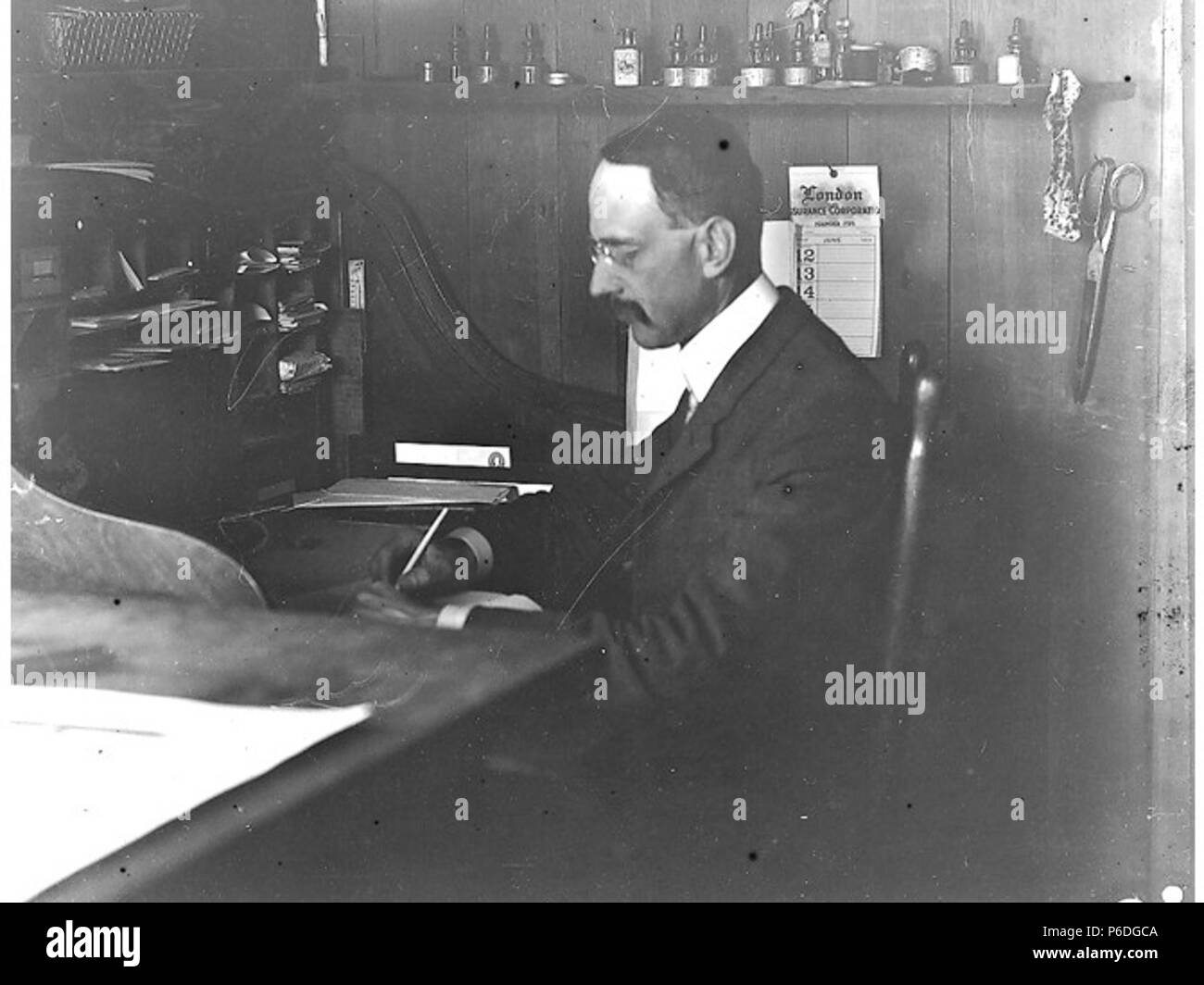 . English: H. Ambrose Kiehl in engineer's office at Fort Lawton, Washington, 1905 . English: Text from Kiehl log: H.A.K. office at Fort Lawton. 1905. Album 1.059 Subjects (LCSH): Kiehl, H. Ambrose; Engineers--Washington (State)--Fort Lawton (Seattle); Military bases--Washington (State)--Seattle; Fort Lawton (Seattle, Wash.)  . 1905 51 H Ambrose Kiehl in engineer's office at Fort Lawton, Washington, 1905 (KIEHL 229) Stock Photo