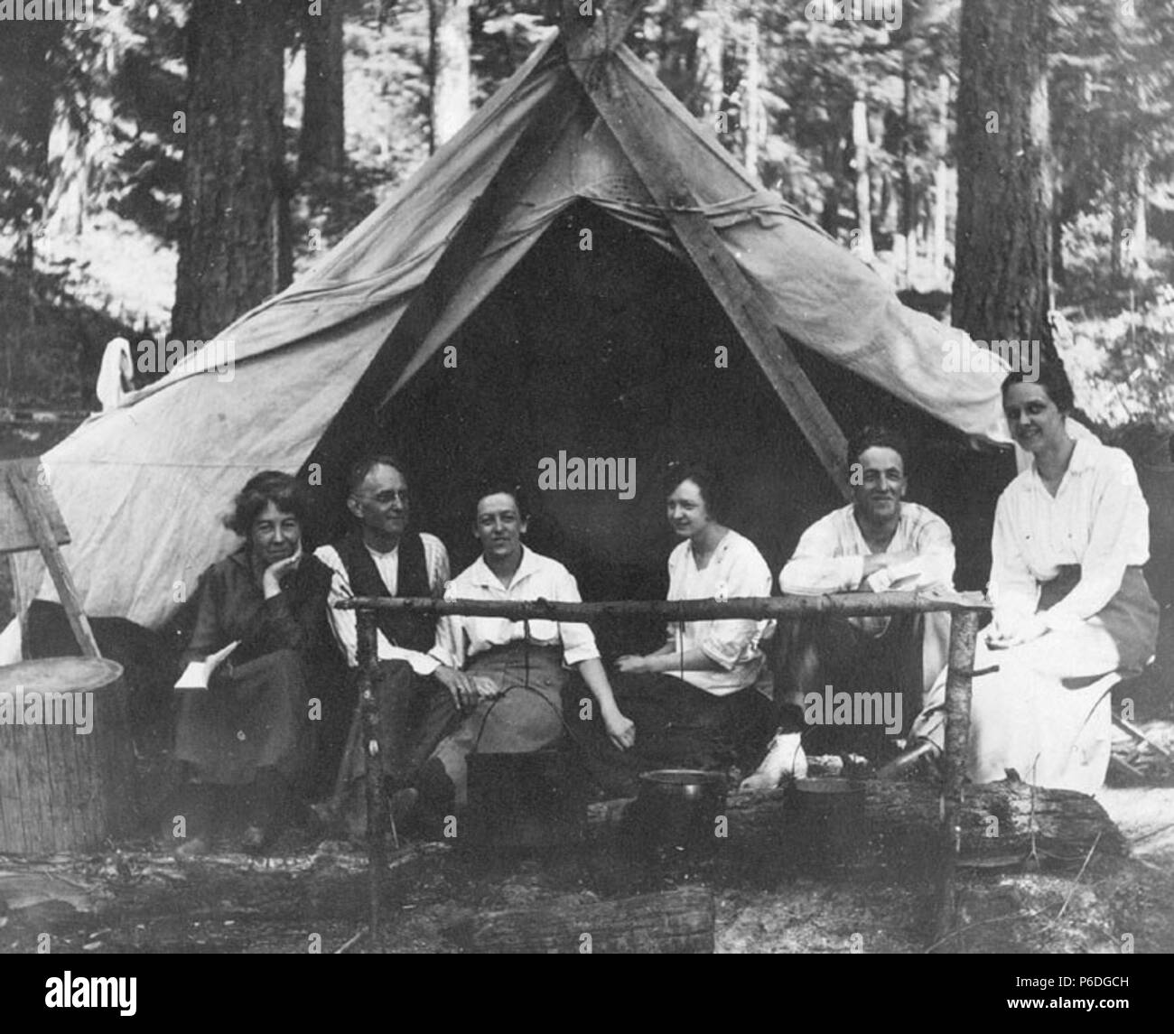. English: H. Ambrose Kiehl, Laura Kiehl, and others at a campsite, Washington, July 15, 1917 . English: Caption on image: July 15, 1917 Album 1.230 Subjects (LCSH): Kiehl, H. Ambrose; Kiehl, Laura; Camp sites, facilities, etc.--Washington (State); Tents--Washington (State); Campers (Persons)--Washington (State) Concepts: Recreational activities  . 1917 51 H Ambrose Kiehl, Laura Kiehl, and others at a campsite, Washington, July 15, 1917 (KIEHL 281) Stock Photo