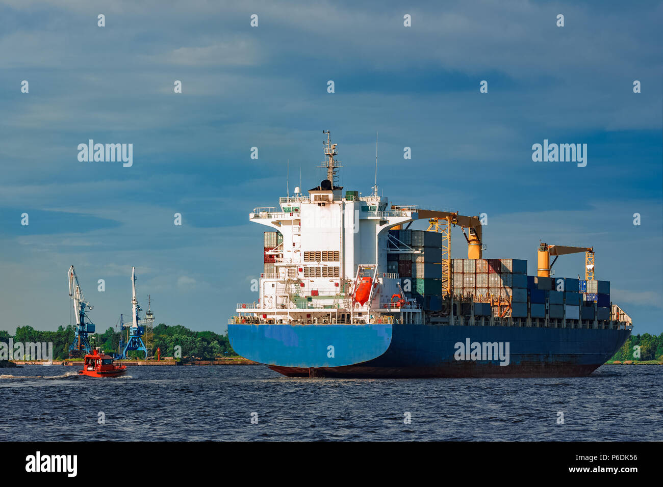 Blue container ship. World logistics and production transfer Stock