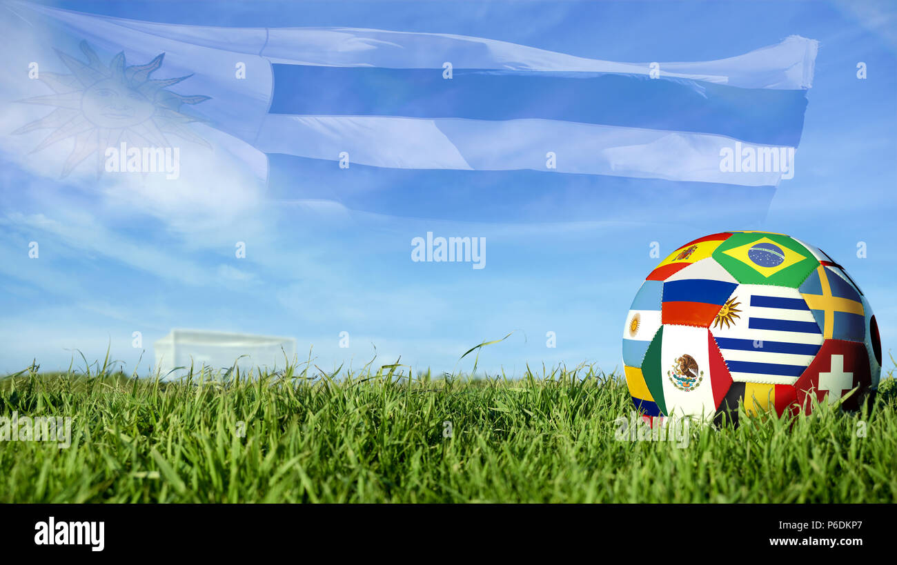 Soccer ball with Uruguay flag for russian sport event, Uruguayan team celebration. Realistic football on goal post field over blue sky background. Inc Stock Photo