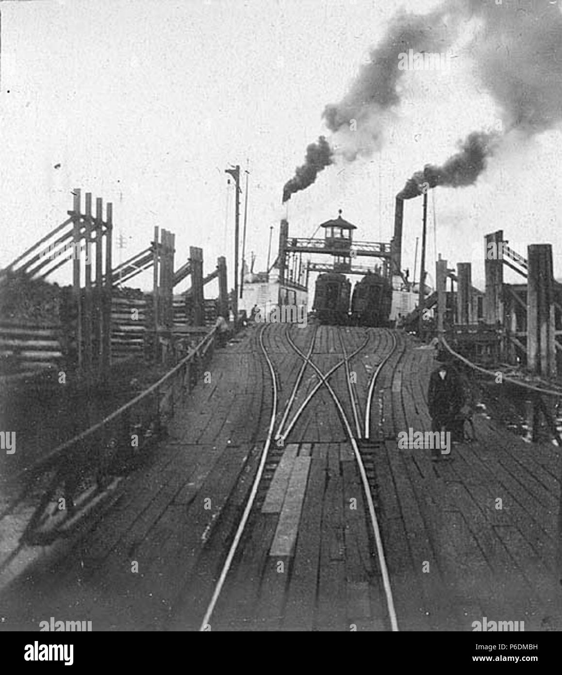 . English: Northern Pacific Railroad loading area for the ferry TACOMA, November 8, 1900 . English: The ferry Tacoma transported trains across the Columbia River from Goble, Oregon to Kalama, Washington from 1884 until 1908 . Text from Kiehl log: Ferry 'Tacoma' N.P.R.R., Nov. 8, 1900 Album 2.303 Subjects (LCSH): Tacoma (Ferry); Railroad tracks--United States; Boat trains--United States  . 1900 64 Northern Pacific Railroad loading area for the ferry TACOMA, November 8, 1900 (KIEHL 267) Stock Photo