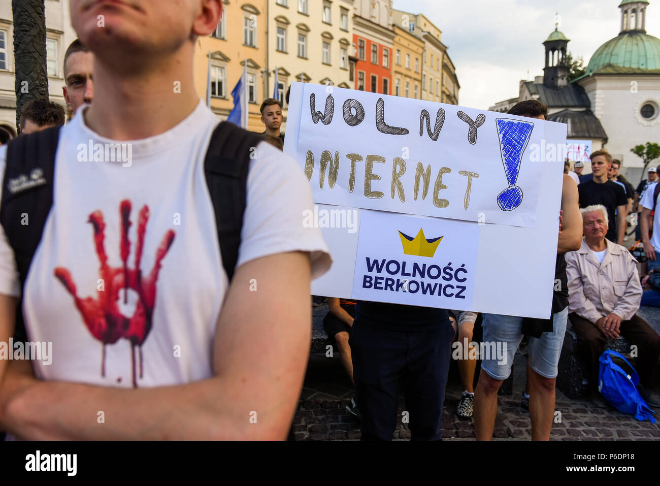 Krakow, Poland. 29th June, 2018. People hold a banner saying "Free internet" during  a protest against the implementation of ACTA 2 ( Anti Counterfeiting Trade Agreement) in European Union. On June 20th, The Legal Affairs Committee of the European Parliament approved the draft directive on copyright on the digital market. The next vote will take place on  July 4th. The European Commission intends to introduce a new tool, allegedly to protect copyrights. Credit: SOPA Images Limited/Alamy Live News Stock Photo