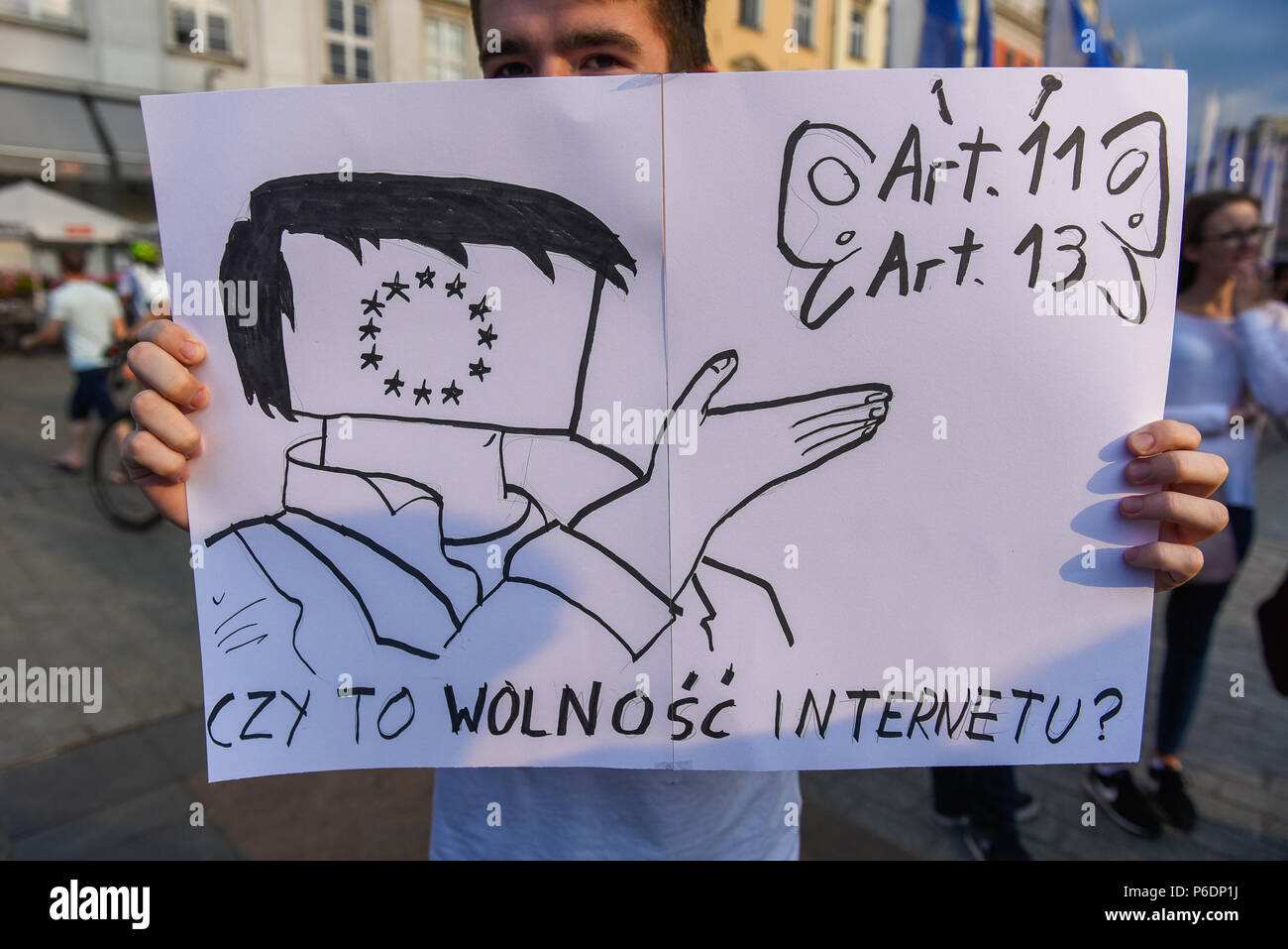 Krakow, Poland. 29th June, 2018. A man holds a banner saying 'is internet free ' during a protest against the implementation of ACTA 2 ( Anti Counterfeiting Trade Agreement) in European Union. On June 20th, The Legal Affairs Committee of the European Parliament approved the draft directive on copyright on the digital market. The next vote will take place on  July 4th. The European Commission intends to introduce a new tool, allegedly to protect copyrights. Credit: SOPA Images Limited/Alamy Live News Stock Photo