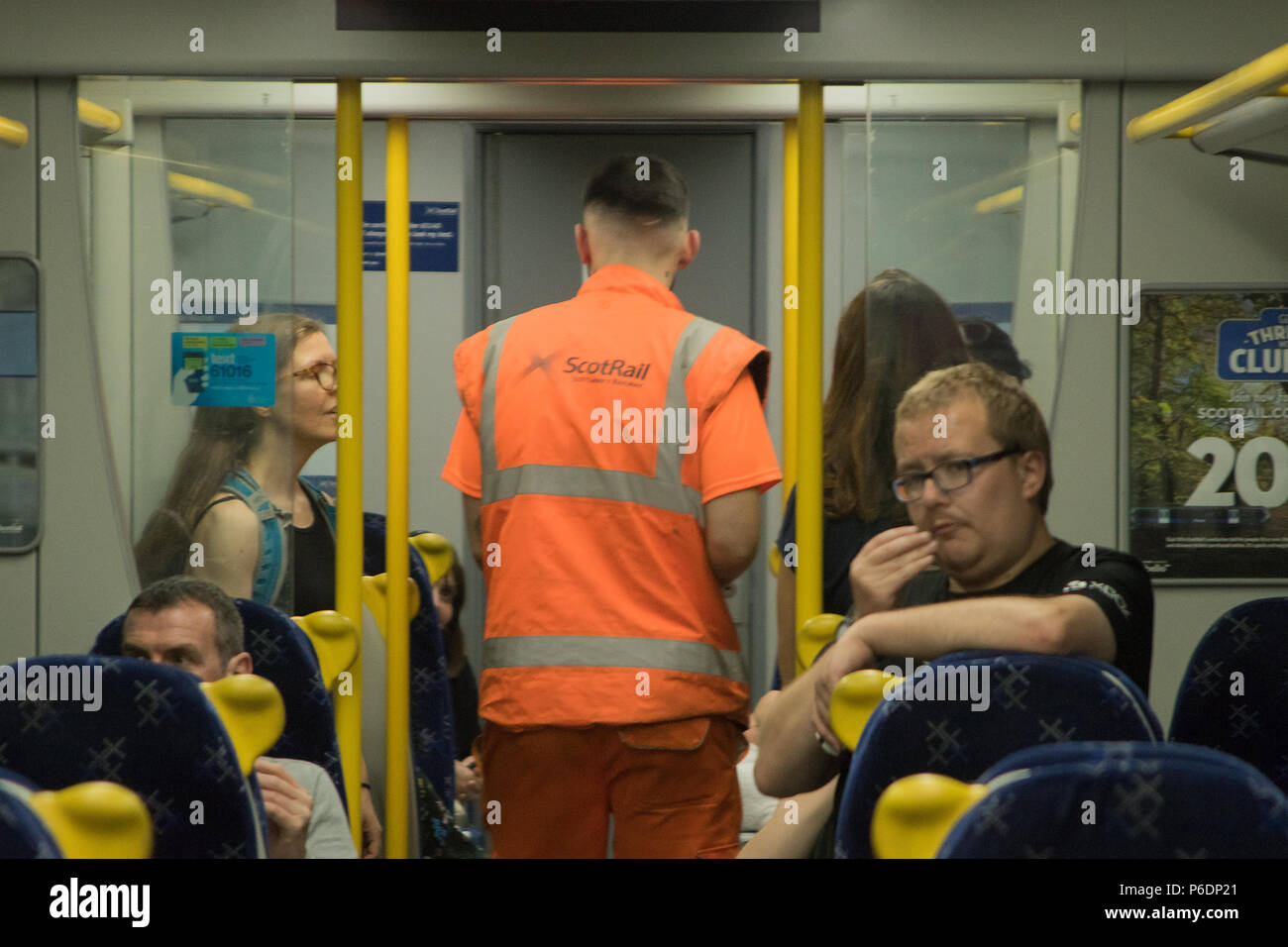 Glasgow, Scotland, UK. 29th June, 2018. A ScotRail train from Helensburgh Central to Edinburgh Waverley has broken down, after suffering brake failure and problems with its electronics systems. The incident happened in a tunnel, between Glasgow's Charing Cross and Queen Street, at about quarter past three on Friday. Engineers arrived quickly to organise a solution. Another train coupled up with the broken-down train and pushed it to Queen Street at a slower than usual speed. All passengers were detrained via the back doors shortly after 17:00. Iain McGuinness / Alamy Live News Stock Photo