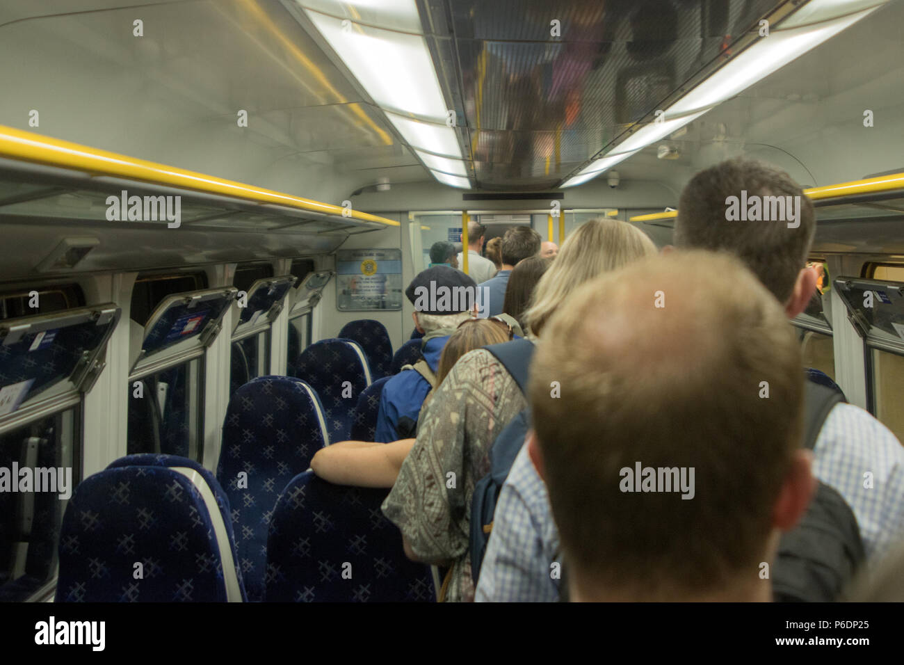 Glasgow, Scotland, UK. 29th June, 2018. A ScotRail train from Helensburgh Central to Edinburgh Waverley has broken down, after suffering brake failure and problems with its electronics systems. The incident happened in a tunnel, between Glasgow's Charing Cross and Queen Street, at about quarter past three on Friday. Engineers arrived quickly to organise a solution. Another train coupled up with the broken-down train and pushed it to Queen Street at a slower than usual speed. All passengers were detrained via the back doors shortly after 17:00. Iain McGuinness / Alamy Live News Stock Photo