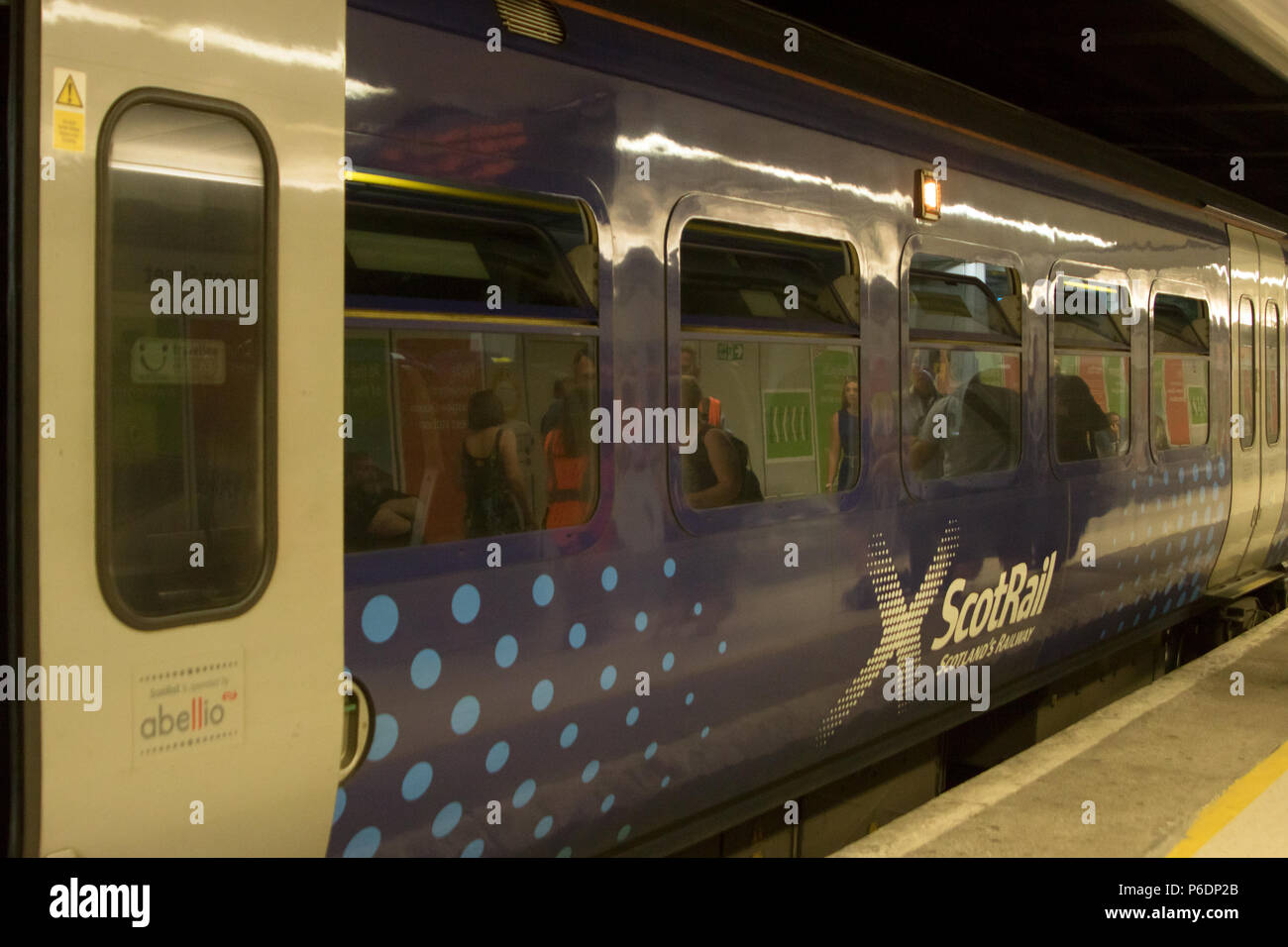 Glasgow, Scotland, UK. 29th June, 2018. A ScotRail train from Helensburgh Central to Edinburgh Waverley has broken down, after suffering brake failure and problems with its electronics systems. The incident happened in a tunnel, between Glasgow's Charing Cross and Queen Street, at about quarter past three on Friday. Engineers arrived quickly to organise a solution. Another train coupled up with the broken-down train and pushed it to Queen Street at a slower than usual speed. All passengers were detrained via the back doors shortly after 17:00. Iain McGuinness / Alamy Live News Stock Photo