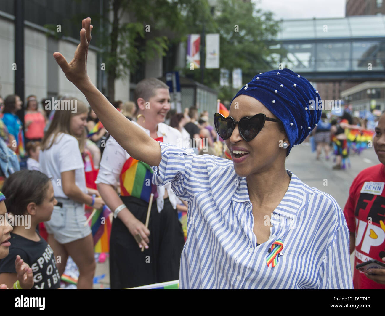 Minneapolis, Minnesota, USA. 24th June, 2018. State Rep. ILHAN OMAR, the DFL endorsed candidate for the U.S. 5th congressional district, campaigns at the Pride parade in Minneapolis, MN. Credit: Craig Lassig/ZUMA Wire/Alamy Live News Stock Photo