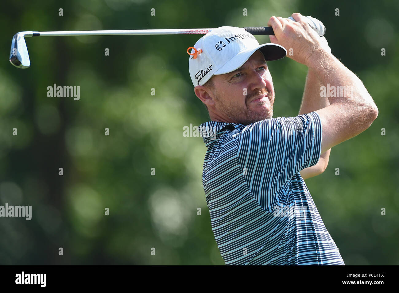JUNE 29, 2018 - Jimmy Walker (USA) tees off with a two iron on the short par four fourteenth hole during the second round at the 2018 Quicken Loans National at the Tournament Players Club in Potomac Maryland. Stock Photo