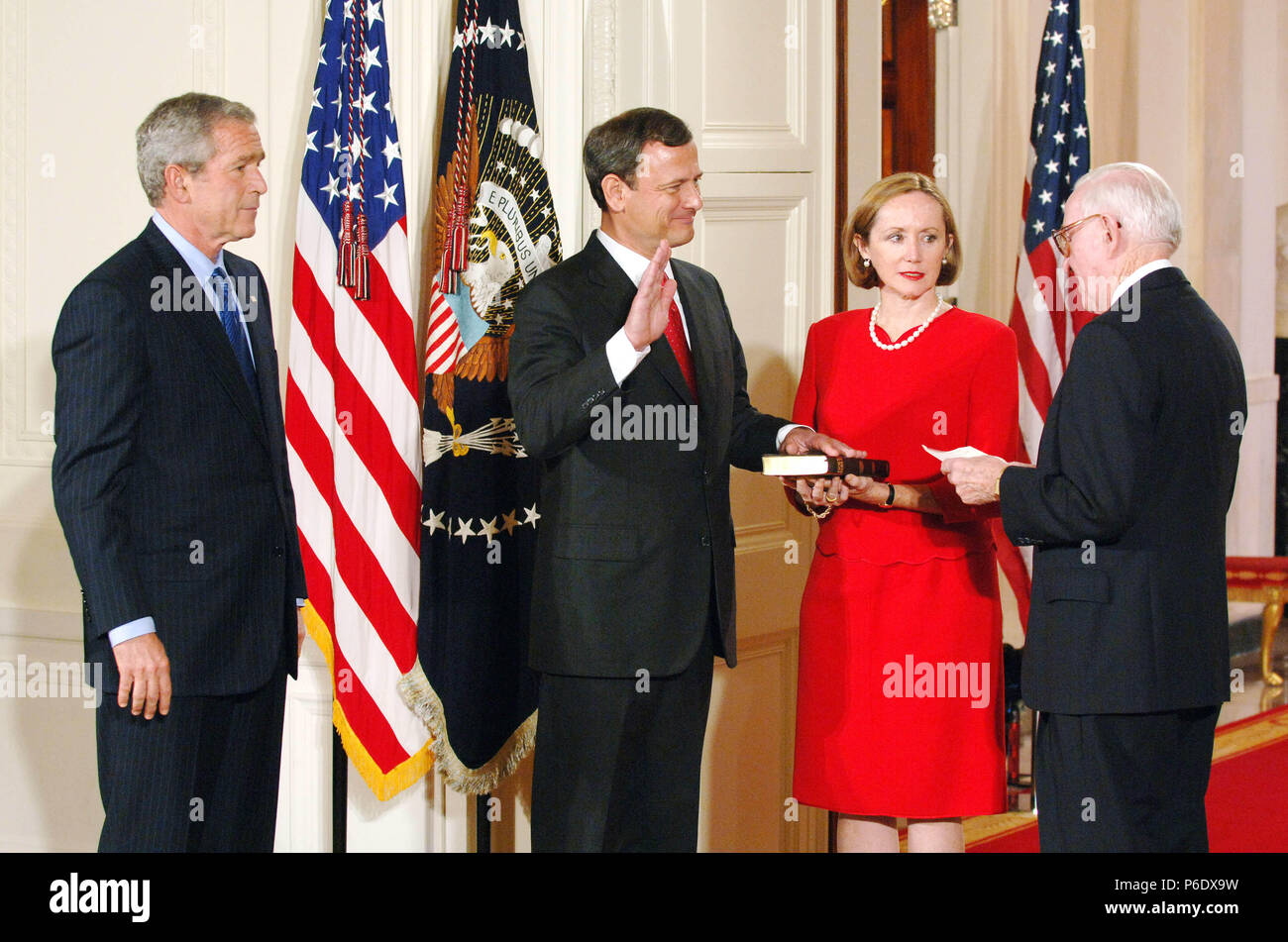 Washington, District of Columbia, USA. 29th Sep, 2005. John Roberts is sworn in as the 17th Chief Justice of the .Supreme Court in the East Room of the White House by .Supreme Court Justice Stevens as his wfe holds the bible and .Pres. Bush looks on.9-29-2005. - - 2005.I10084CB Credit: Christy Bowe/Globe Photos/ZUMAPRESS.com/Alamy Live News Stock Photo
