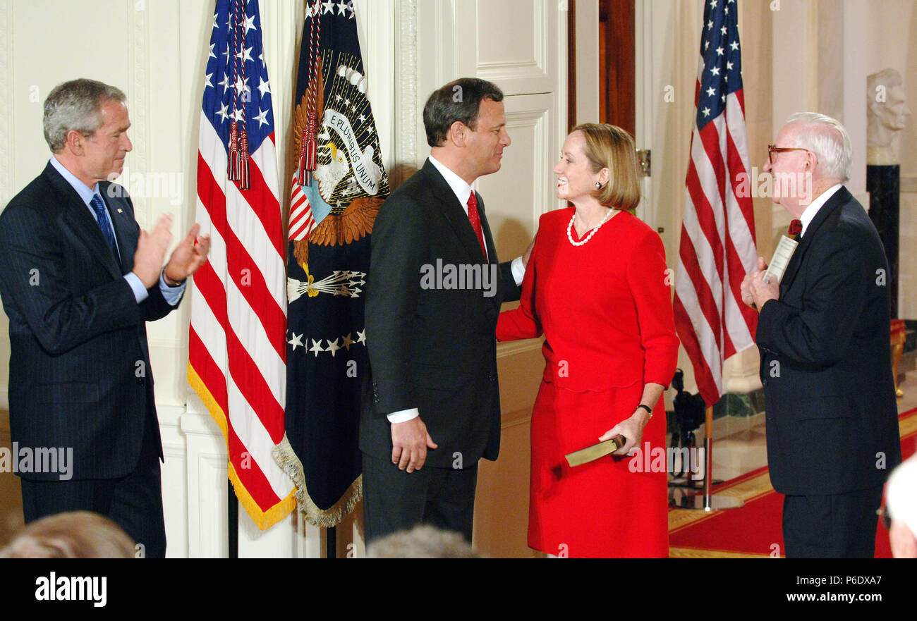 Washington, District of Columbia, USA. 29th Sep, 2005. John Roberts is sworn in as the 17th Chief Justice of the .Supreme Court in the East Room of the White House by .Supreme Court Justice Stevens as his wfe holds the bible and .Pres. Bush looks on.9-29-2005. - - 2005.I10084CB Credit: Christy Bowe/Globe Photos/ZUMAPRESS.com/Alamy Live News Stock Photo