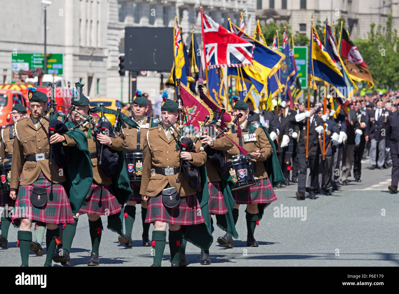 Liverpool, UK. 30th June 2018. 103 Regiment Royal Artillery Pipes and Drums and members of the