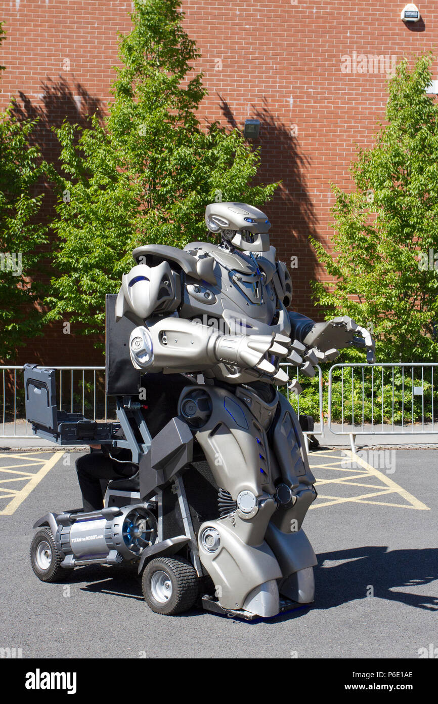 Futuristic Robotic entertainers at the Lancashire Science Festival where Titan the Robot partially-mechanised robot costume developed by the British company Cyberstein Robots performed a fun filled show to hundreds of spectators at the Lancashire University science event. Stock Photo