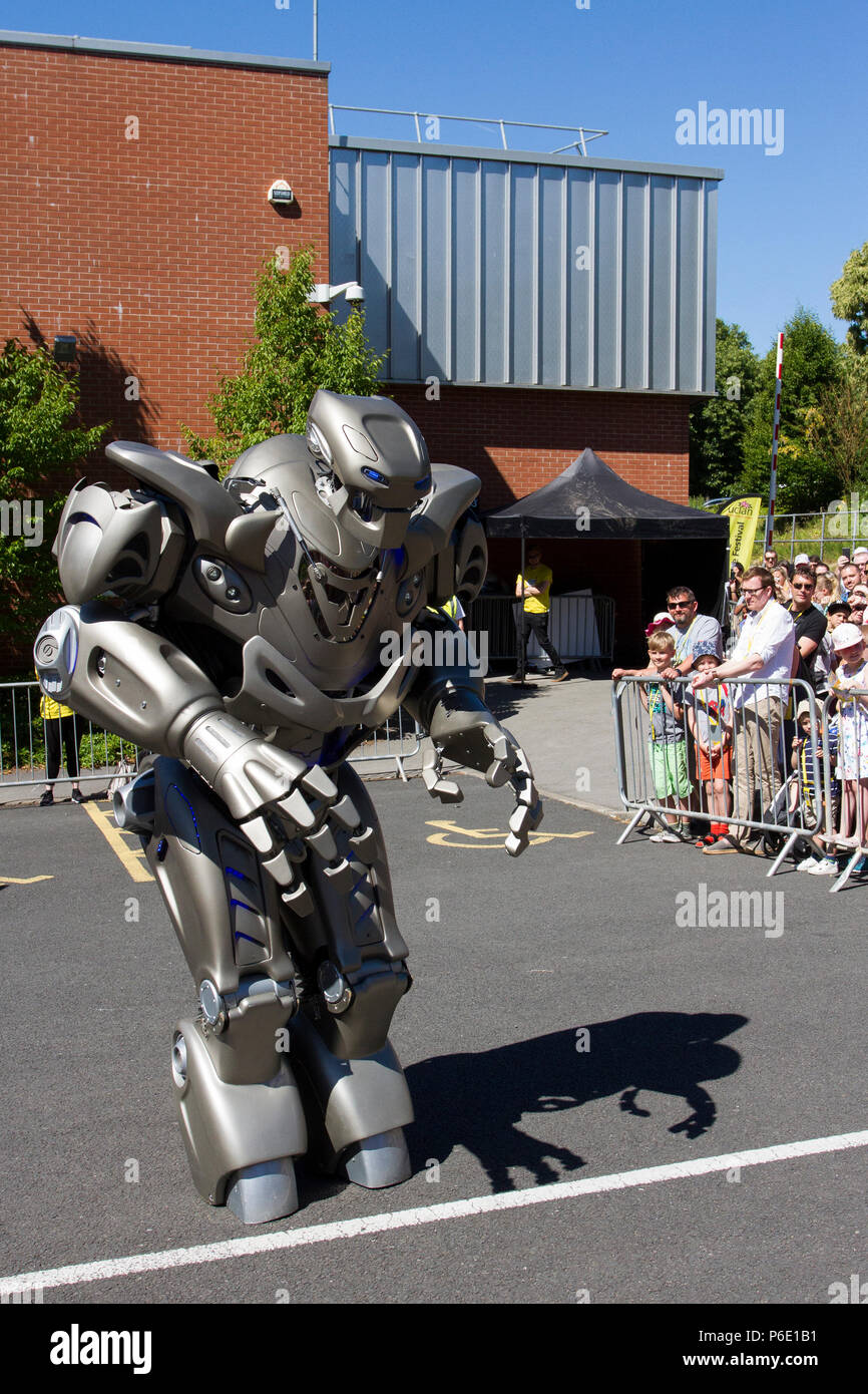 Futuristic Robotic entertainers at the Lancashire Science Festival where Titan the Robot partially-mechanised robot costume developed by the British company Cyberstein Robots performed a fun filled show to hundreds of spectators at the Lancashire University science event. Stock Photo