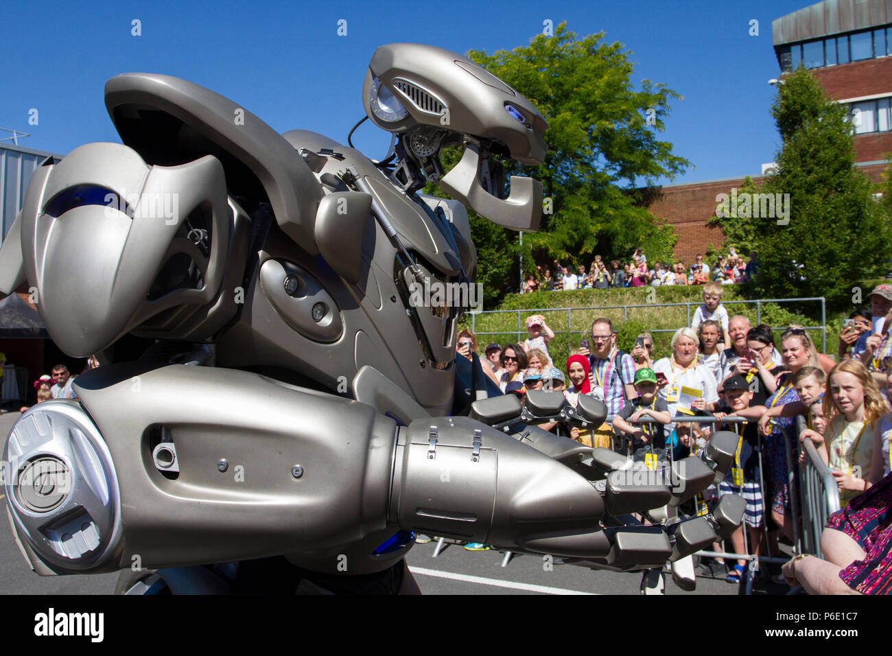 Futuristic Robotic entertainers at the Lancashire Science Festival where Titan the Robot partially-mechanised robot costume developed by the British company Cyberstein Robots performed a fun filled show to hundreds of spectators at the Lancashire University science event. Stock Photo