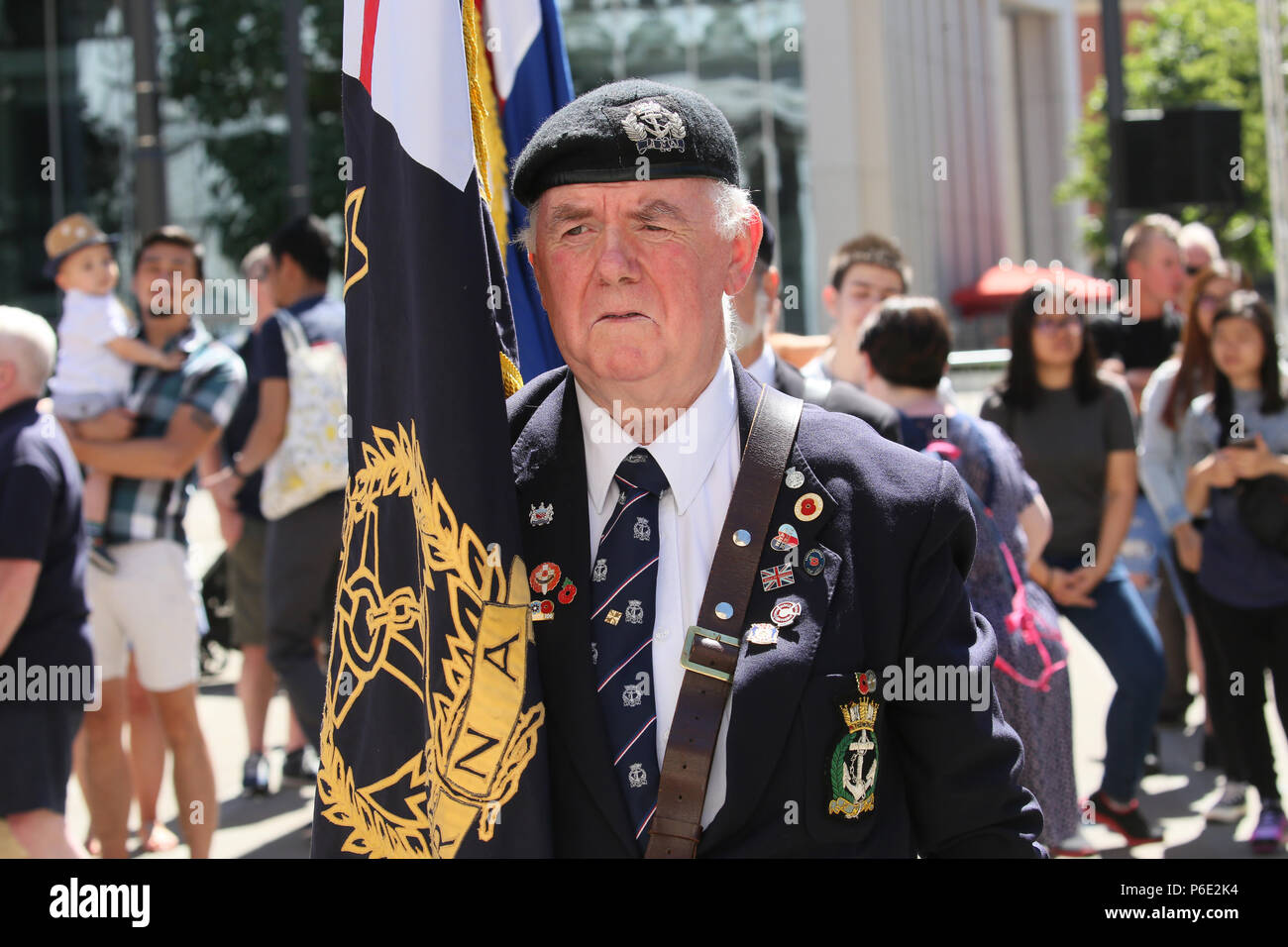 Manchester, UK, 30 June 2018. A veteran holding the standard during celebrations of Armed Forces Day where the public are given the opportunity to meet members of the armed forces and talk to them about the work they do, St Peters Square, Manchester, 30th June, 2018 (C)Barbara Cook/Alamy Live News Stock Photo