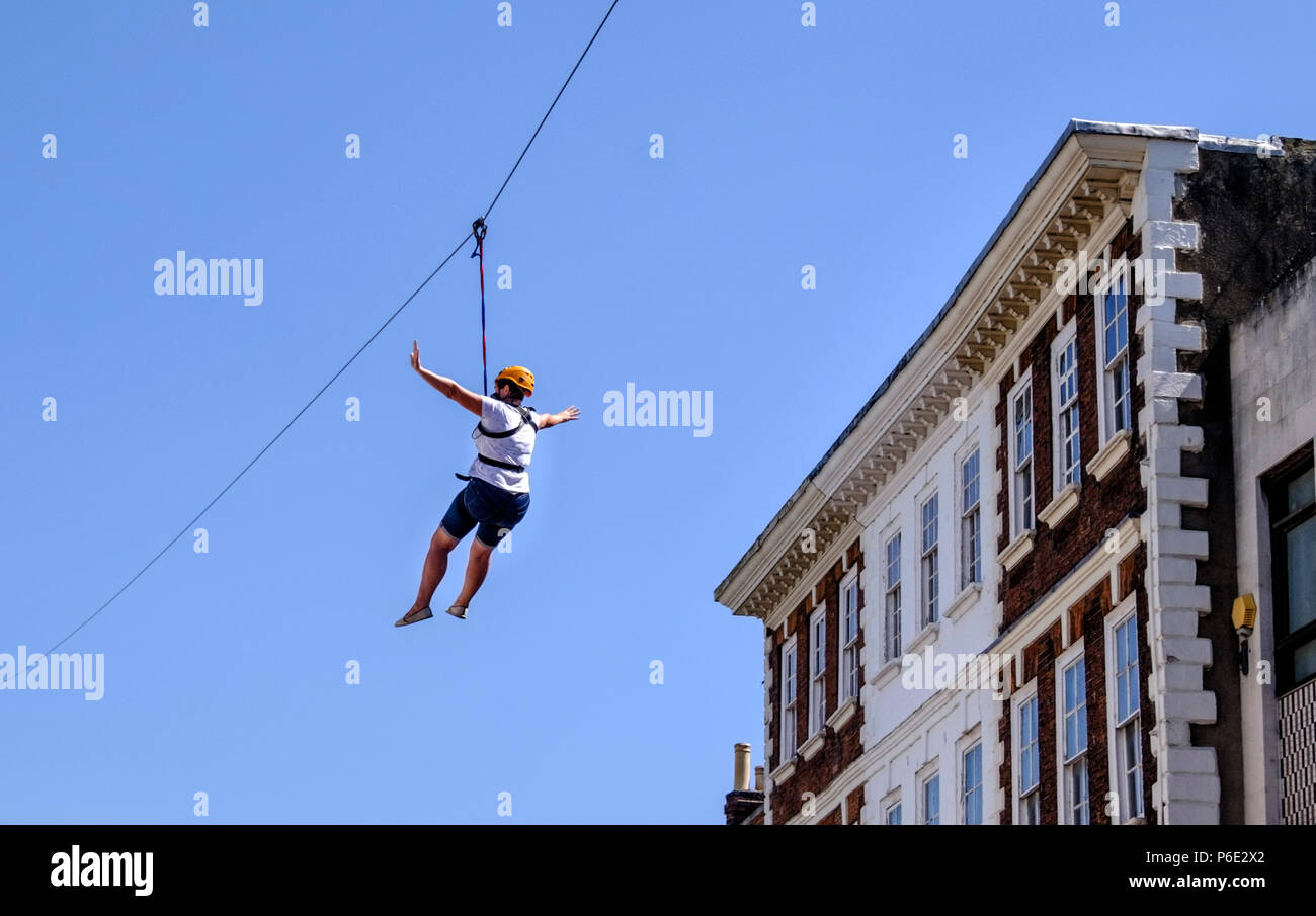 Gloucester, UK, 30th June 2018. A zip wire has been erected in Gloucester city Center, it is about 1100 feet long, running along Northgate and southgate streets. For two days thrill seekers can enjoy a aerial view of historic gloucester as it zooms past at 40mph. ©JMF News / Alamy Live News Stock Photo