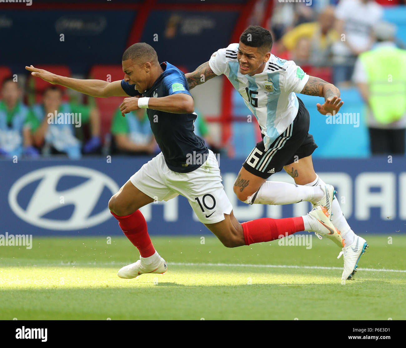 (180630) -- KAZAN, June 30, 2018 (Xinhua) -- Kylian Mbappe (L) of France is fouled by Marcos Rojo of Argentina during the 2018 FIFA World Cup round of 16 match between France and Argentina in Kazan, Russia, on June 30, 2018. (Xinhua/Lu Jinbo) Stock Photo