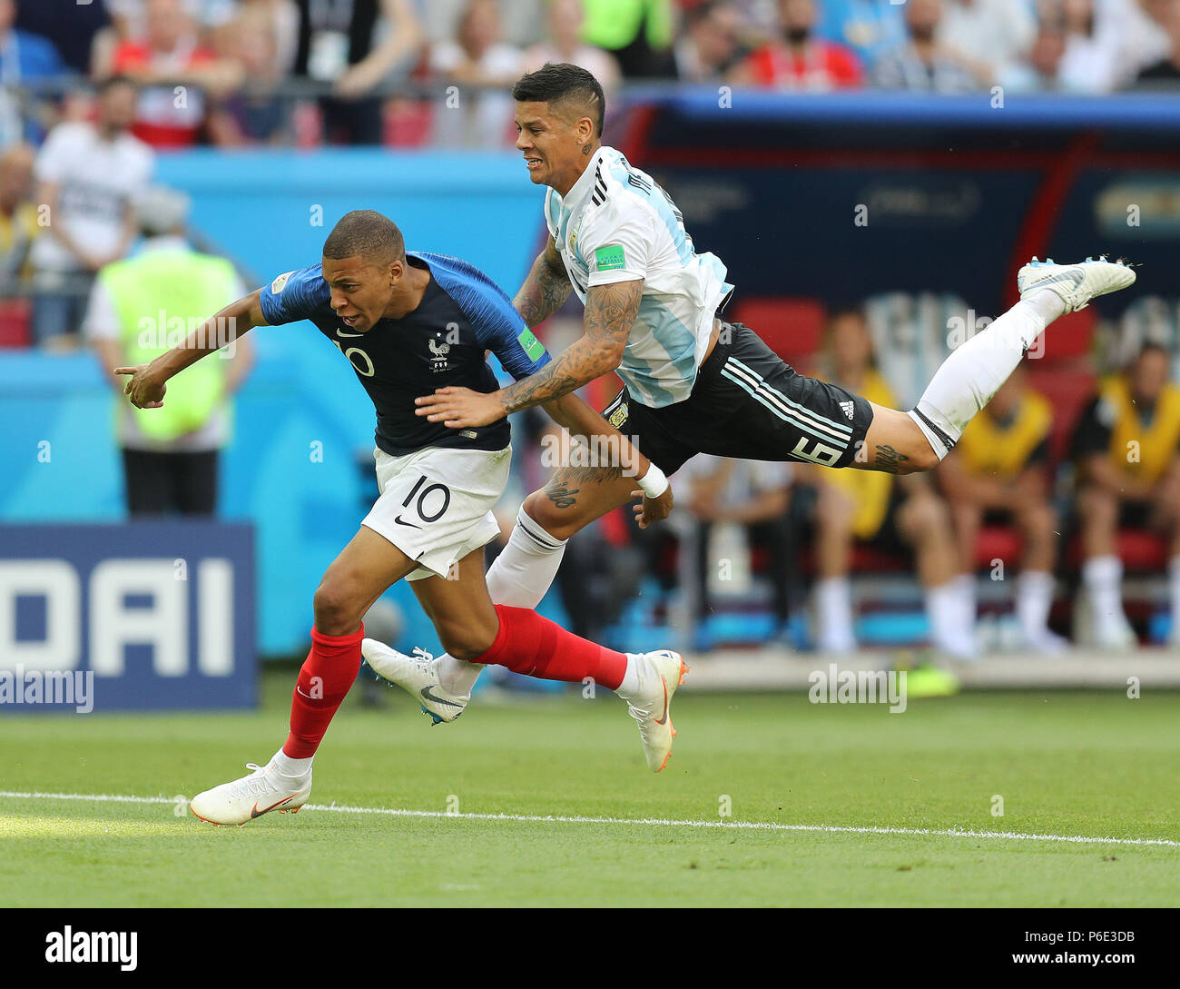 (180630) -- KAZAN, June 30, 2018 (Xinhua) -- Kylian Mbappe (L) of France is fouled by Marcos Rojo of Argentina during the 2018 FIFA World Cup round of 16 match between France and Argentina in Kazan, Russia, on June 30, 2018. (Xinhua/Lu Jinbo) Stock Photo