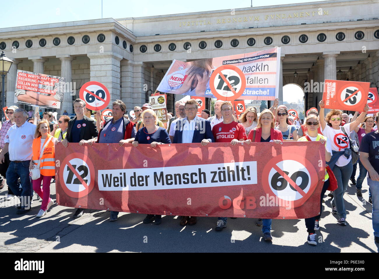 Vienna, Austria. 30 June 2018. Demonstration of the ÖGB (Austrian Trade Union Confederation) against the 12 hours day planned by the Austrian government and the 60 hours week. Picture shows a banner with the inscription 'Because man counts'. Credit: Franz Perc / Alamy Live News Stock Photo