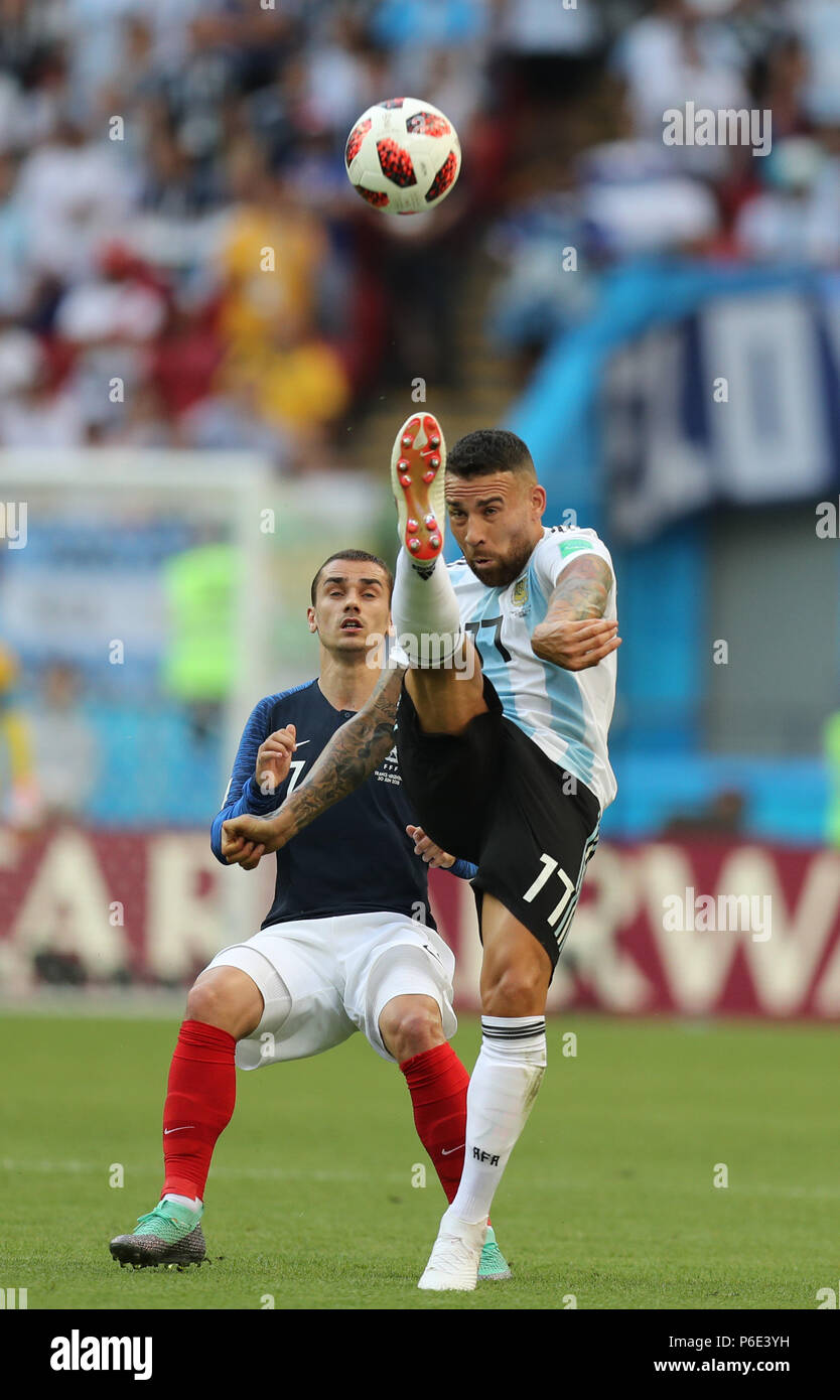 (180630) -- KAZAN, June 30, 2018 (Xinhua) -- Nicolas Otamendi (R) of Argentina vies with Antoine Griezmann of France during the 2018 FIFA World Cup round of 16 match between France and Argentina in Kazan, Russia, on June 30, 2018. (Xinhua/Lu Jinbo) Stock Photo