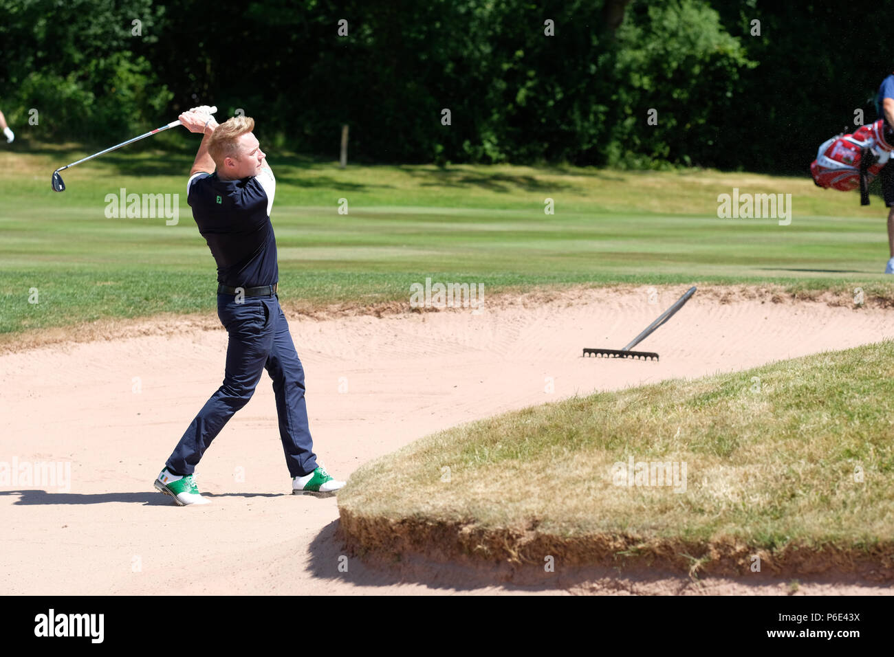 Celebrity Cup golf tournament - Celtic Manor, Newport, Wales, UK - Saturday 30th June - Singer Ronan Keating playing for Team Ireland plays a bunker shot in the afternoon session at the Celebrity Cup. Photo Steven May / Alamy Live News Stock Photo