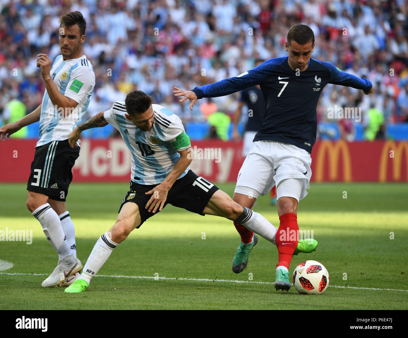 (180630) -- KAZAN, June 30, 2018 (Xinhua) -- Antoine Griezmann (R) of France vies with Lionel Messi (C) of Argentina during the 2018 FIFA World Cup round of 16 match between France and Argentina in Kazan, Russia, June 30, 2018. (Xinhua/Li Ga) Stock Photo