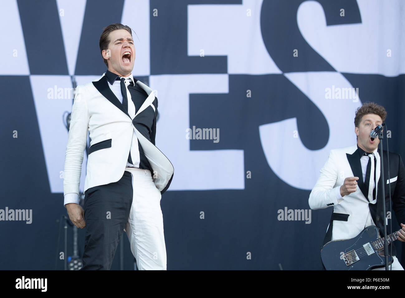 Finsbury park, UK. 30th June, 2018, Swedish rock band The Hives Featuring Pelle Almqvist, Niklas Almqvist, Christian Grahn, Dr. Matt Destruction, Vigilante Carlstroem, Randy Fitzsimmons performing at Queens of the Stone Age and Friends.UK.Finsbury park London.© Jason Richardson / Alamy Live News Stock Photo