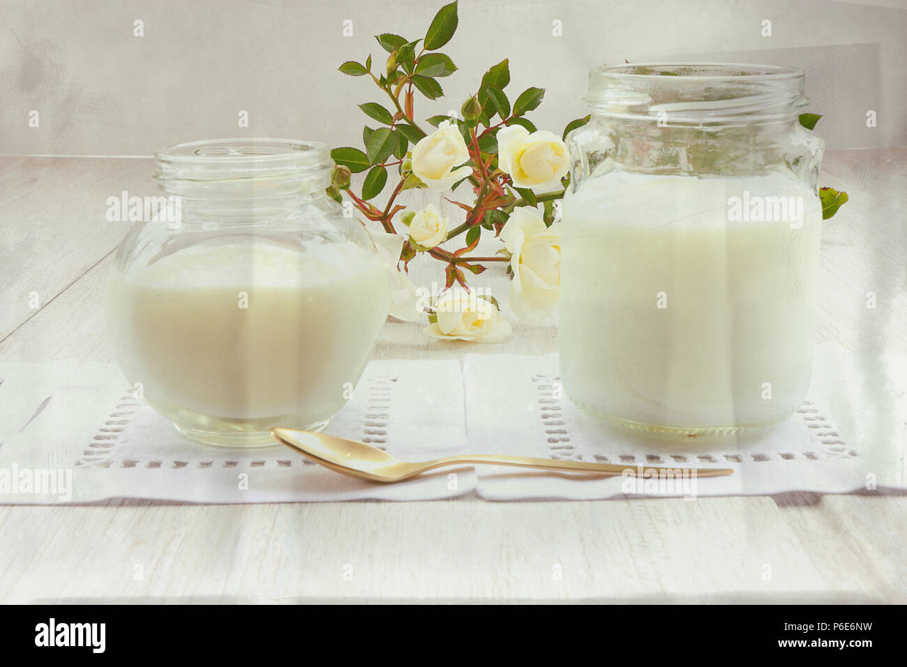 Yogurt and gold teaspoon Stock Photo Alamy