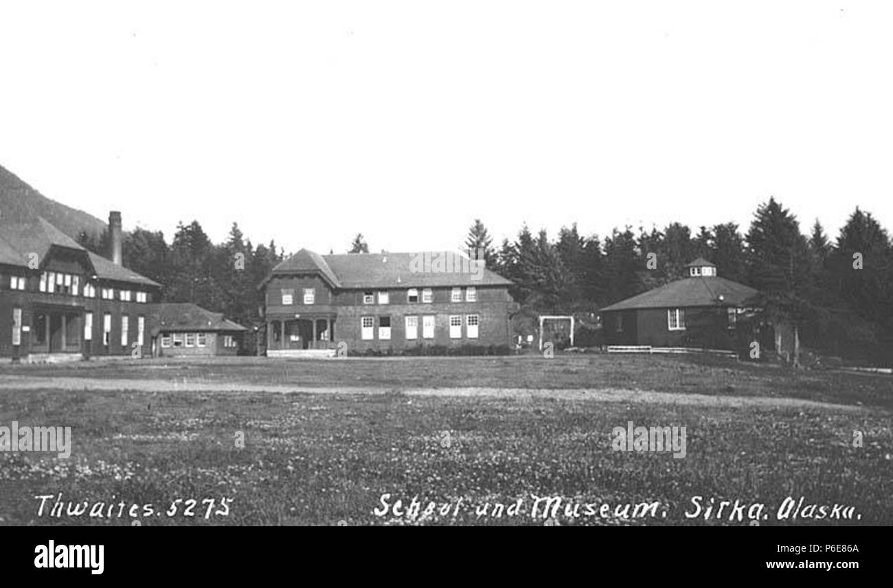 . English: Sheldon Jackson School and Museum buildings, Sitka, ca. 1914 . English: Caption on image: School and Museum, Sitka, Alaska PH Coll 247.693 Sheldon Jackson College is the oldest educational institution in continuous existence in the State of Alaska. It had its beginning in 1878 when Presbyterian missionaries John G. Brady (later Governor of Alaska) and Fannie Kellogg opened the upper floor of an old military barracks as a training school for Tlingit Indians. In 1882, the building burned to the ground. Another Presbyterian missionary, Dr. Sheldon Jackson, came to the rescue. He initia Stock Photo