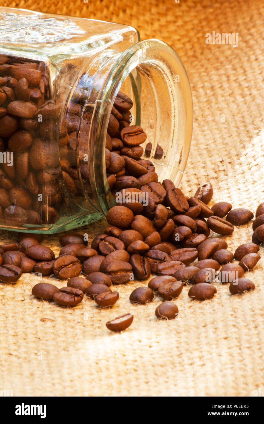 Roast coffee beans on burlap Stock Photo