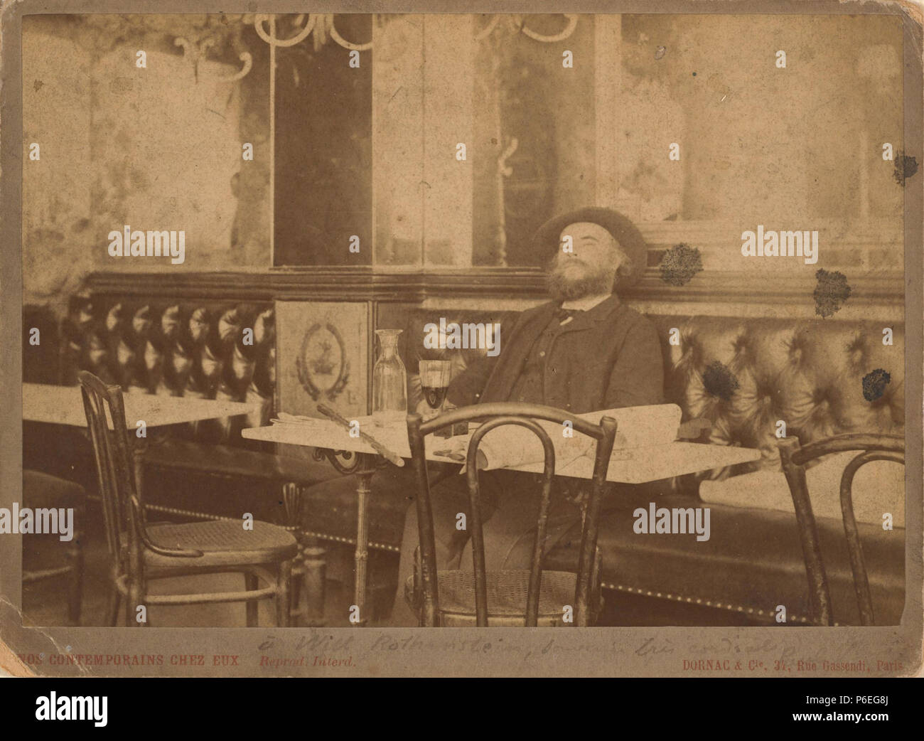English: Photograph of French poet Paul Verlaine (1844-1896), seated at a table in the Café François Ier, Paris, 1892. Photographed by Dornac. MS Eng 1148 (1749), Houghton Library, Harvard University . 28 May 1892 53 Houghton MS Eng 1148 (1749) - Paul Verlaine Stock Photo