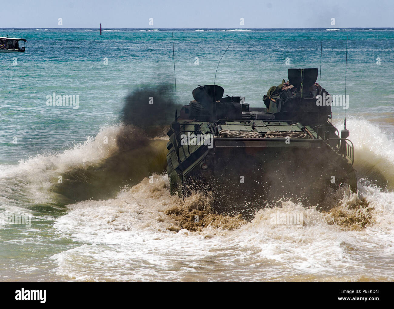 Marines with Bravo Company, 3rd Assault Amphibian Battalion, enter the ocean with their Assault Ampbhibious Vehicle (AAV) on Camp Schwab beach, Okinawa, Japan, June 29, 2018. This training maintains the units readiness and proficiency while on deployment in the Pacific. The company is forward-deployed to the 3rd Marine Division as part of the Unit Deployment Program. (U.S. Marine Corps photo by Lance Cpl. Nathan Maysonet) Stock Photo