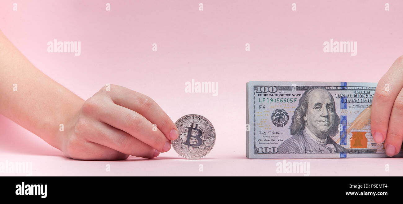 Dollars And Bitcoin In A Woman s Hand On A Pink Background With Copy dollars-and-bitcoin-in-a-woman-s-hand-on-a-pink-background-with-copy
