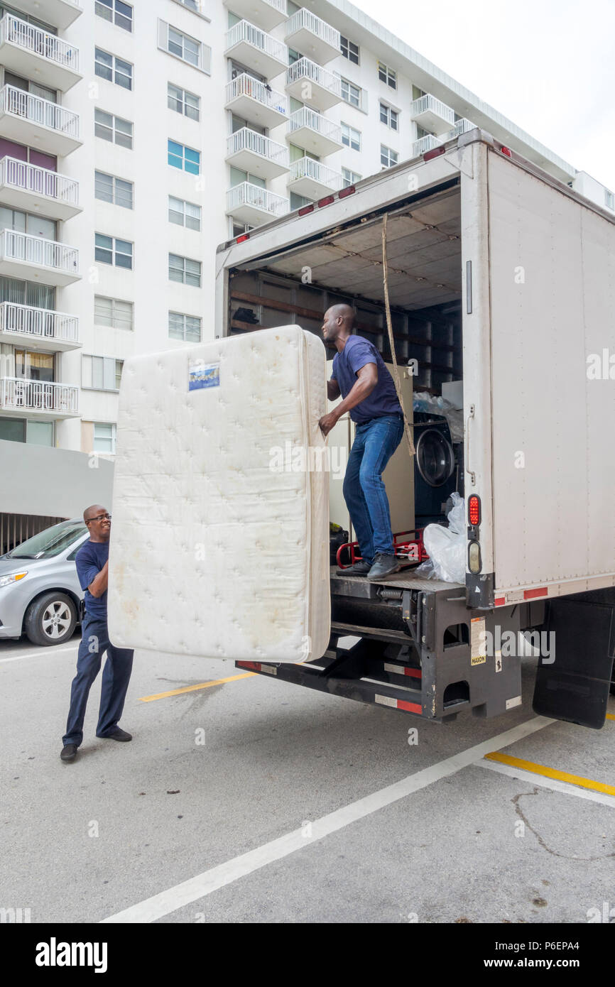 Miami Beach Florida,mattress delivery truck,Black man men male,delivering,unloading,manual labor,FL171015075 Stock Photo