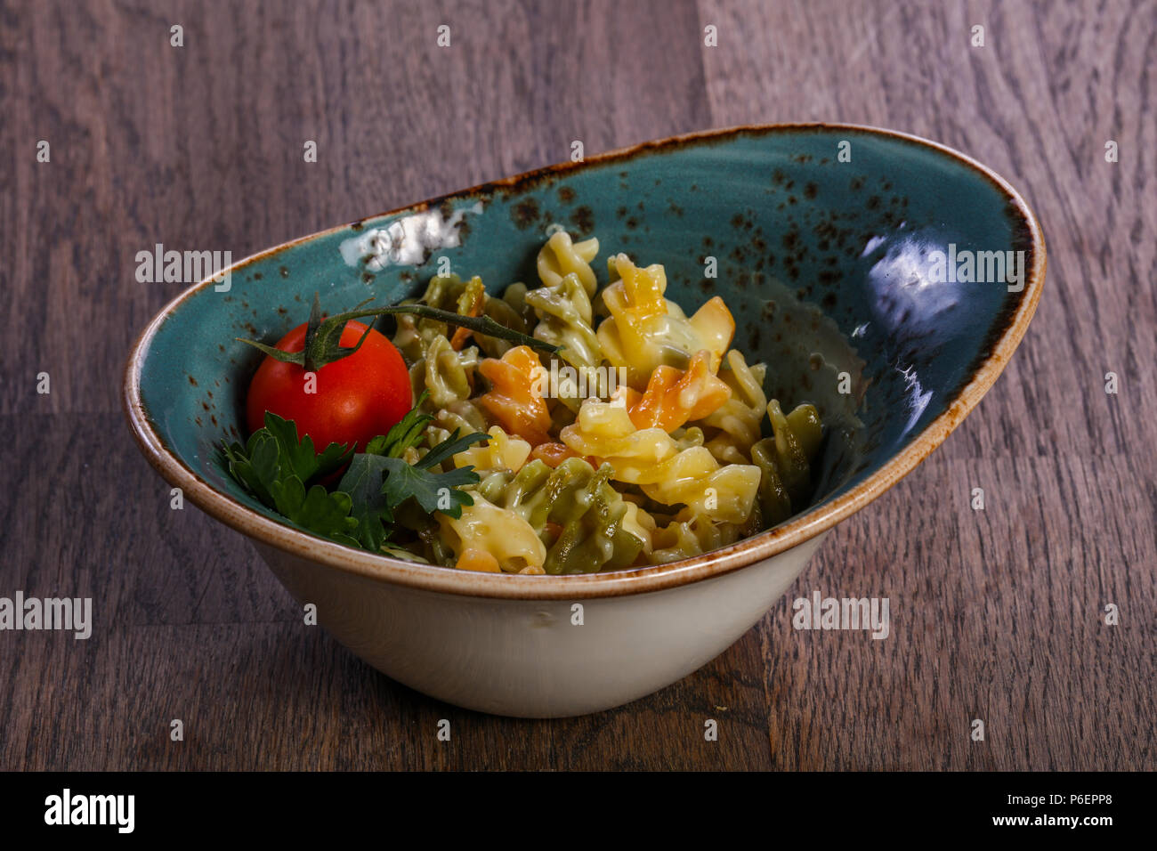 Kids pasta with sauce served tomato Stock Photo - Alamy