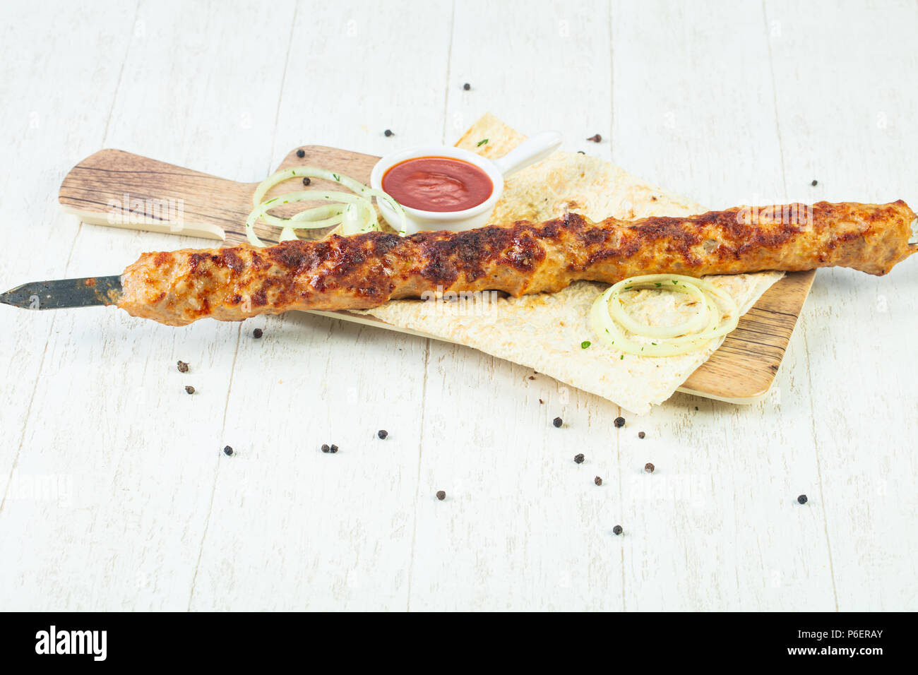 Grilled minced chicken kebab with sauce and onion Stock Photo Alamy