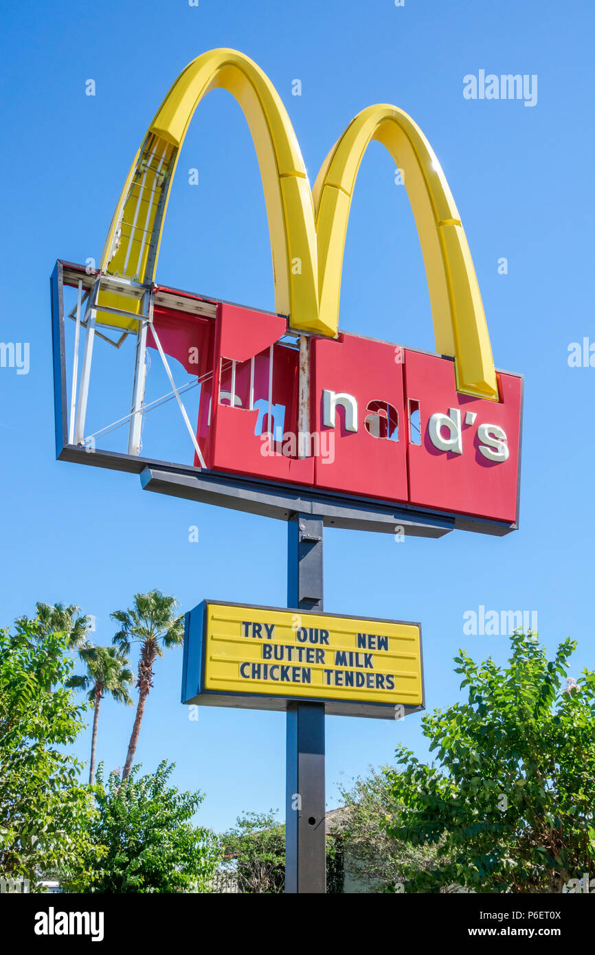 Winter Park Florida,McDonald's,fast food,restaurant restaurants dining cafe cafes,after Hurricane Irma,wind damaged golden arches sign,FL171028023 Stock Photo