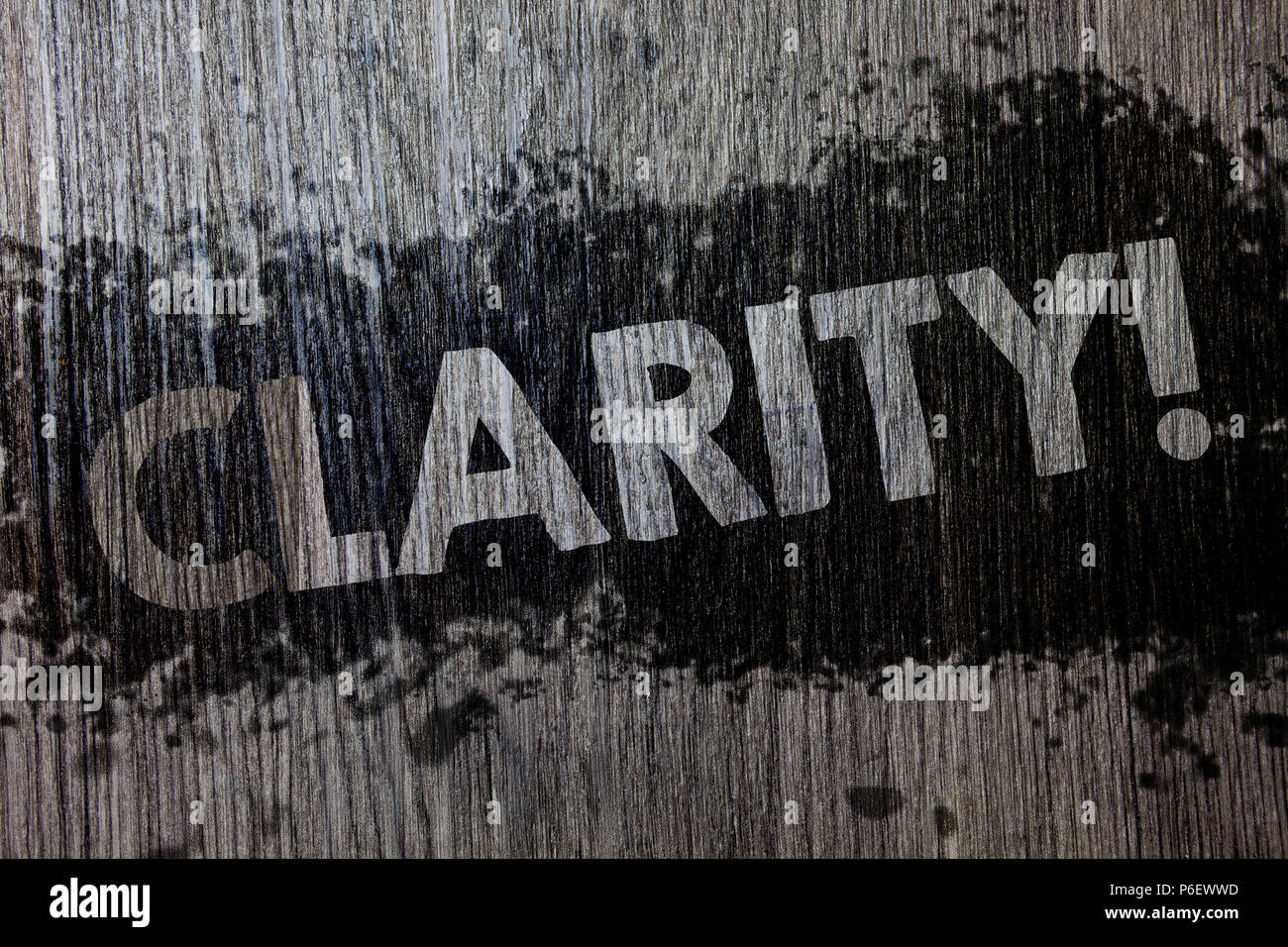Text sign showing Clarity. Conceptual photo Certainty Precision Purity Comprehensibility Transparency Accuracy Wooden wood background black splatter p Stock Photo