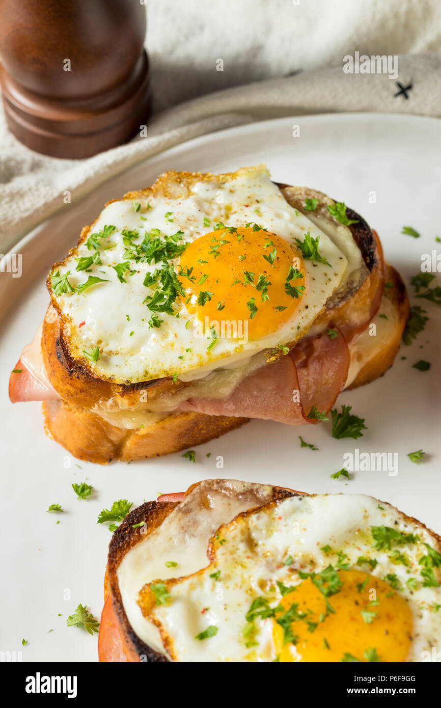 Homemade French Croque Madame Sandwich with Ham and Cheese Stock Photo