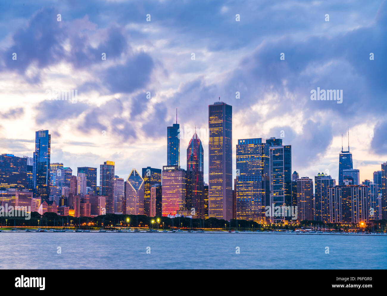 Chicago skyline at sunset with cloudy sky and reflection in water Stock ...