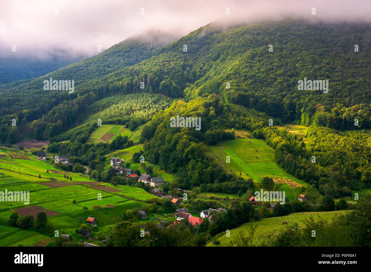 Abranka village in Carpathian mountains. lovely rural scenery on a cloudy sunrise. Stock Photo