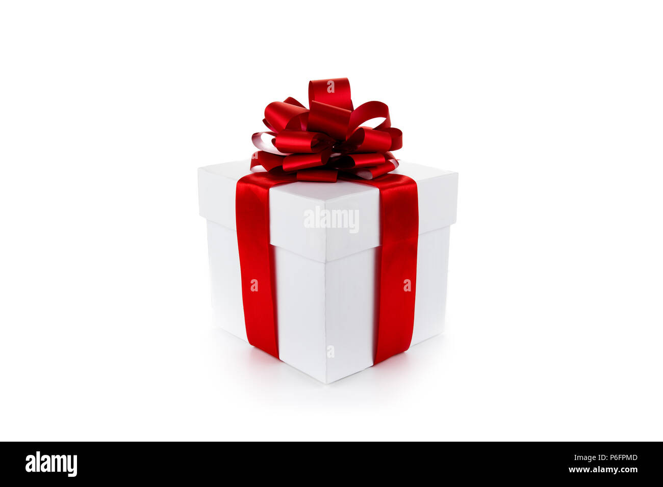 White gift box with red ribbon and bow isolated Stock Photo - Alamy