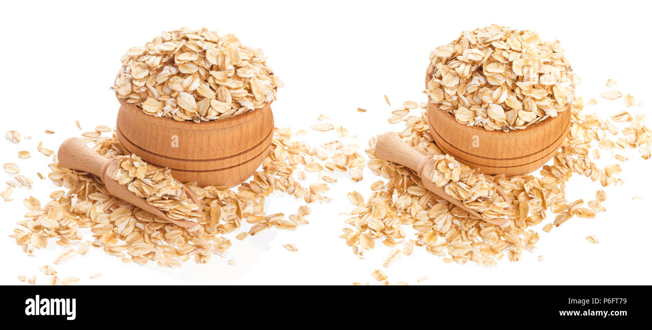 Oat flakes in wooden bowl isolated on white background Stock Photo