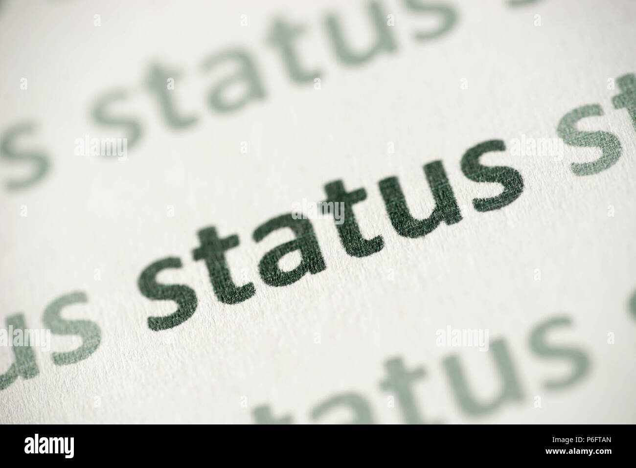 word status printed on white paper macro Stock Photo - Alamy