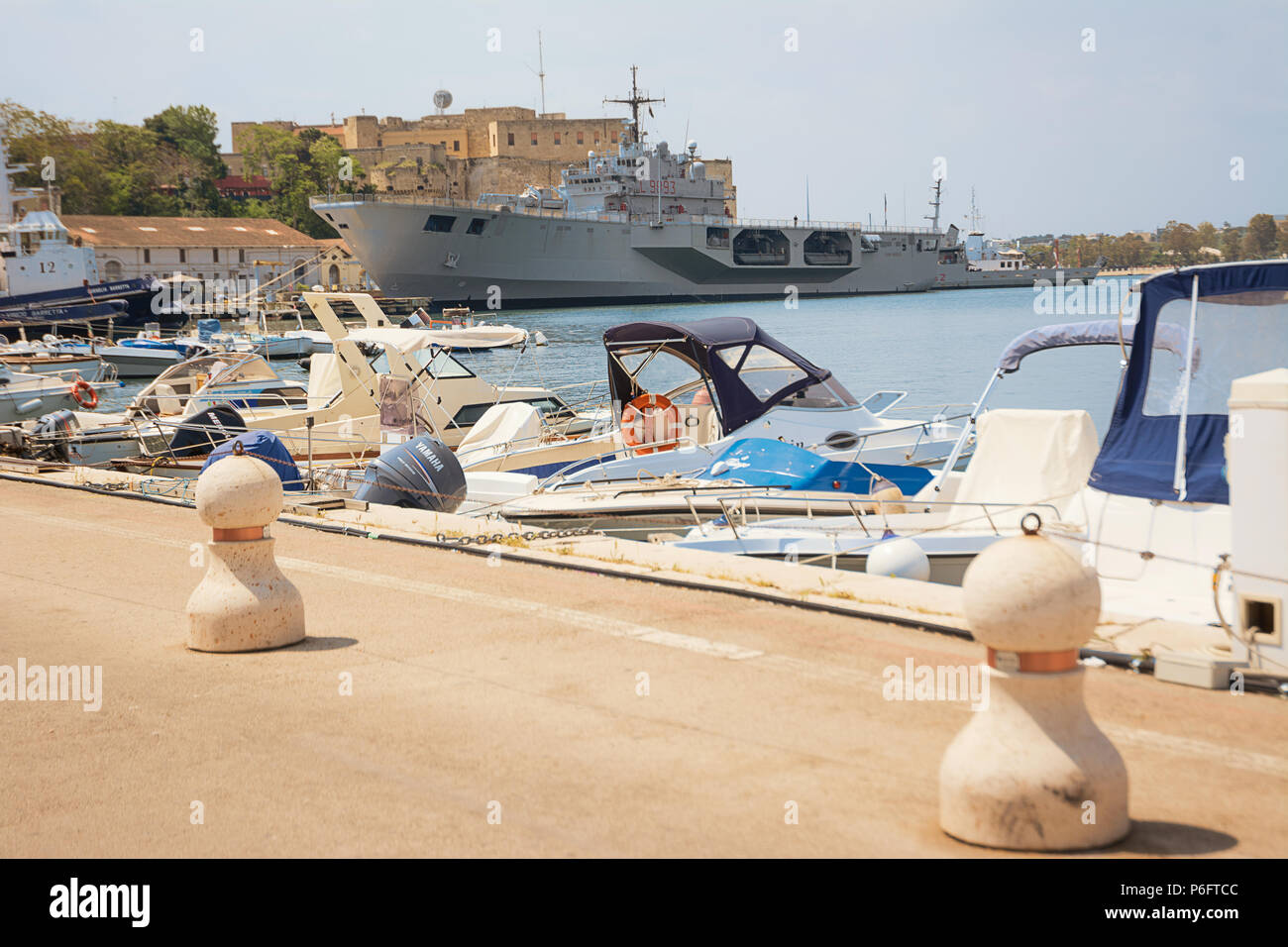 Brindisi, Italy - April 30, 2018: Porto di Brindisi con barche e nave militare ormeggiata nel porto Stock Photo
